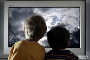 LONDON - JANUARY 27:  In this photo illustration two young child watch television at home, January 27, 2005 in London, England.   (Photo Illustration by Peter Macdiarmid/Getty Images)